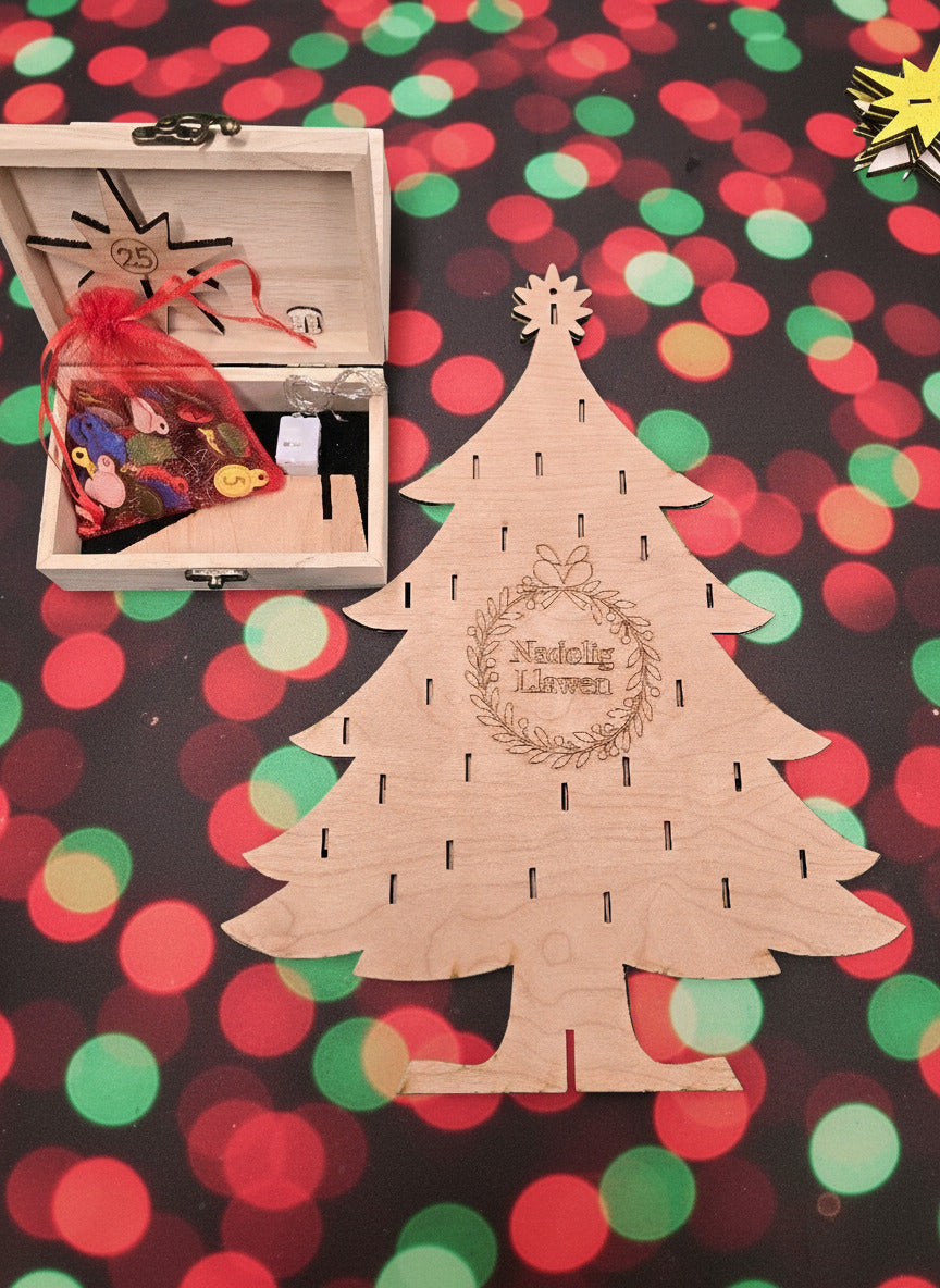 You'll get the tree, 25 wire hooks and 25 colourful baubles with the day of the month, a giant star for the 25th (with a clip to fix it to the tree) and a set of 10 coloured LEDs in a string with a battery case (batteries provided). The tree stands 400mm (approx) high, and is 300mm (approx) wide.